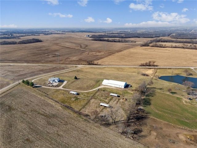 drone / aerial view featuring a water view and a rural view