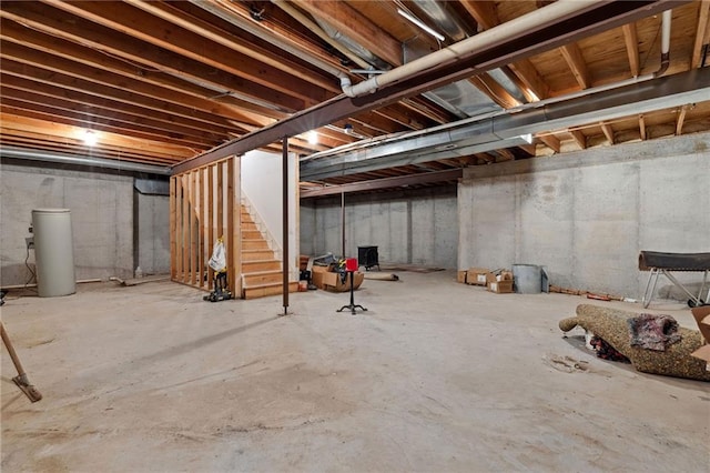 unfinished basement featuring stairway