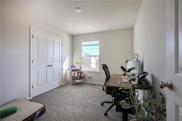 carpeted office space with baseboards