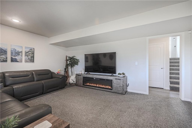 living area with recessed lighting, baseboards, carpet, and stairs