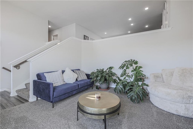 living room featuring recessed lighting, baseboards, and stairs