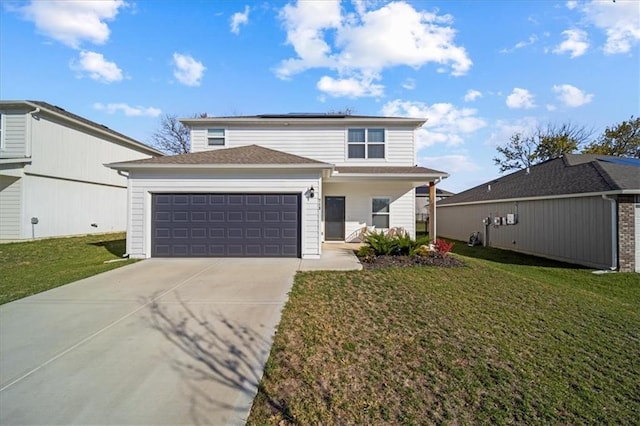 traditional home featuring driveway, an attached garage, a front lawn, and solar panels