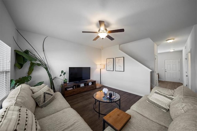 living room with a ceiling fan and wood finished floors