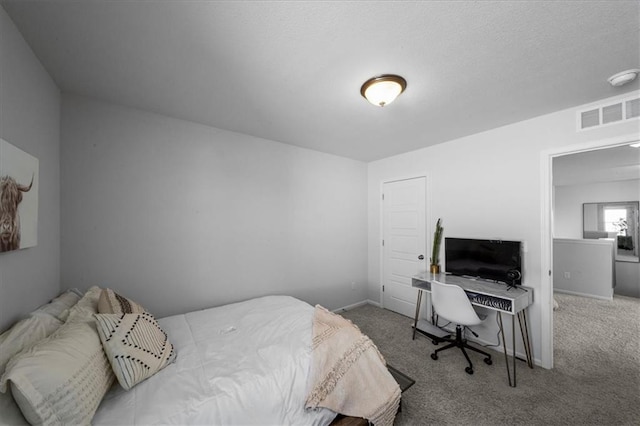 bedroom featuring carpet floors, visible vents, and baseboards