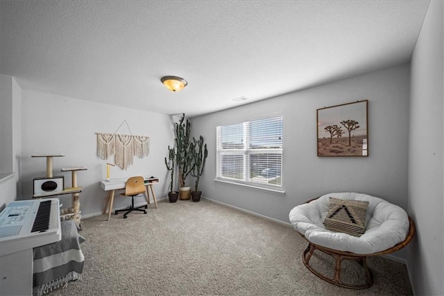 carpeted office featuring visible vents, a textured ceiling, and baseboards