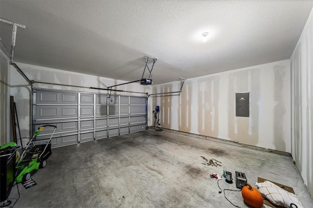 garage featuring electric panel and a garage door opener