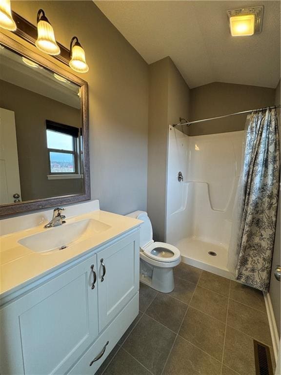 full bathroom featuring visible vents, toilet, a shower with curtain, tile patterned flooring, and vanity