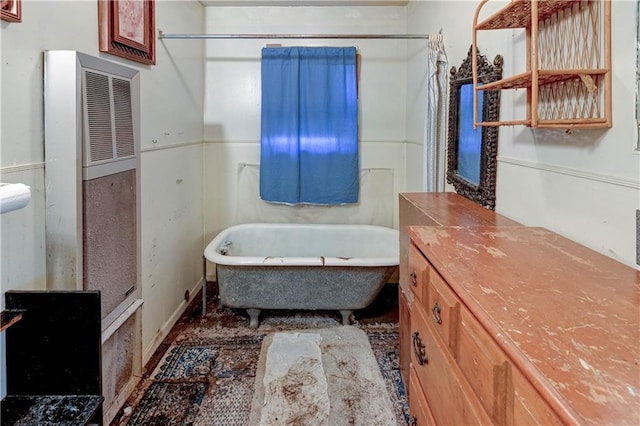 full bathroom featuring curtained shower, a soaking tub, and vanity