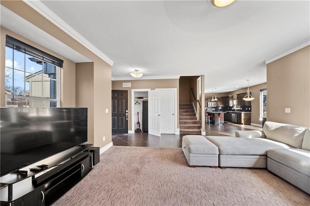 living room featuring visible vents, crown molding, stairway, dark carpet, and dark tile patterned flooring