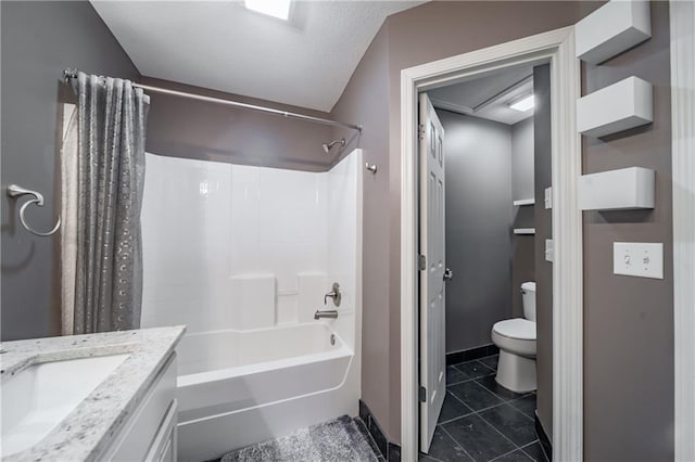 bathroom featuring tile patterned flooring, toilet, vanity, shower / bath combo, and a textured ceiling