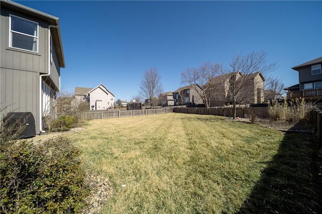 view of yard with a residential view and a fenced backyard