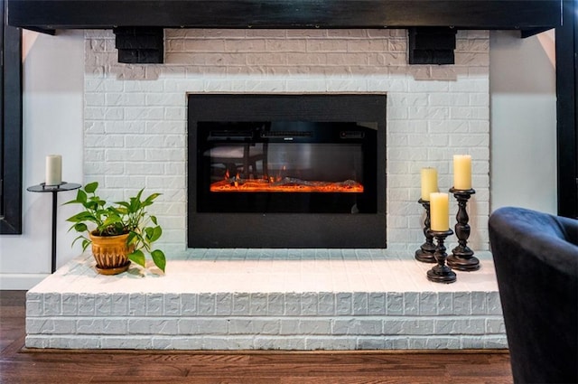 room details with a fireplace and wood finished floors