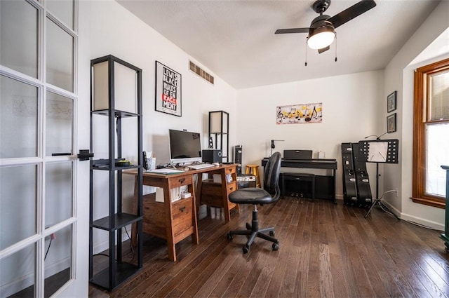 office featuring hardwood / wood-style flooring, ceiling fan, visible vents, and baseboards