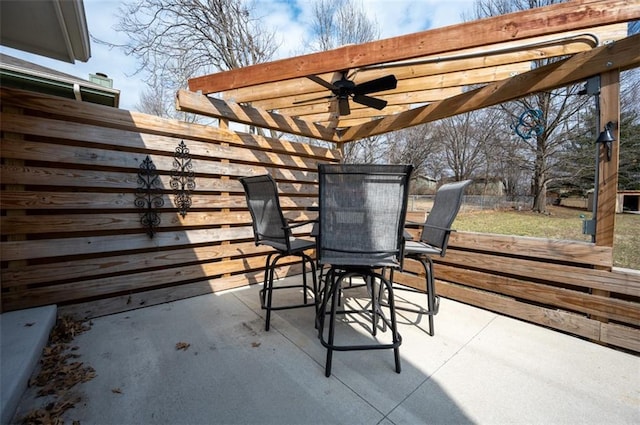 view of patio / terrace with a ceiling fan, outdoor dining area, and a pergola