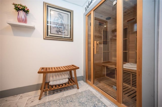 view of sauna with marble finish floor and baseboards