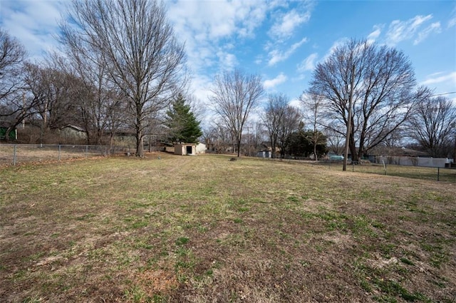 view of yard with an outdoor structure and fence