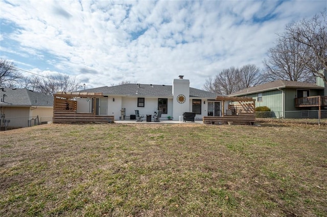 back of property featuring a yard, a patio, a fenced backyard, and a pergola