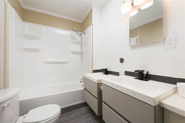 bathroom featuring shower / bathtub combination, toilet, wood finished floors, vanity, and ornamental molding