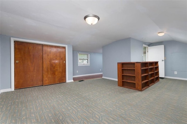 bonus room with carpet, visible vents, and baseboards