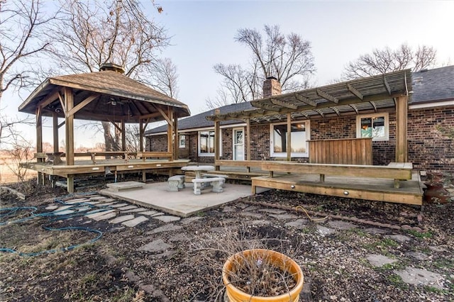 view of patio with a gazebo and a wooden deck