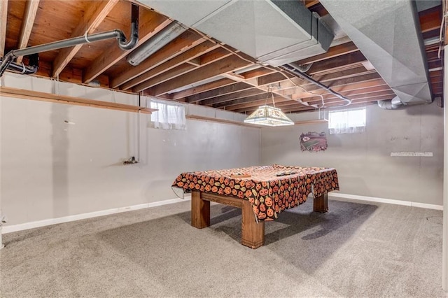 basement with baseboards, carpet floors, and a healthy amount of sunlight