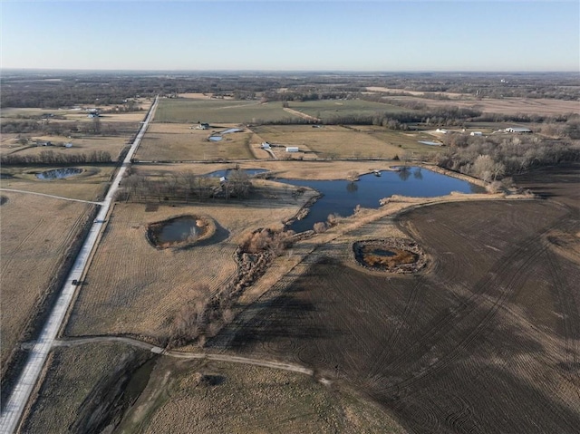 drone / aerial view featuring a rural view and a water view