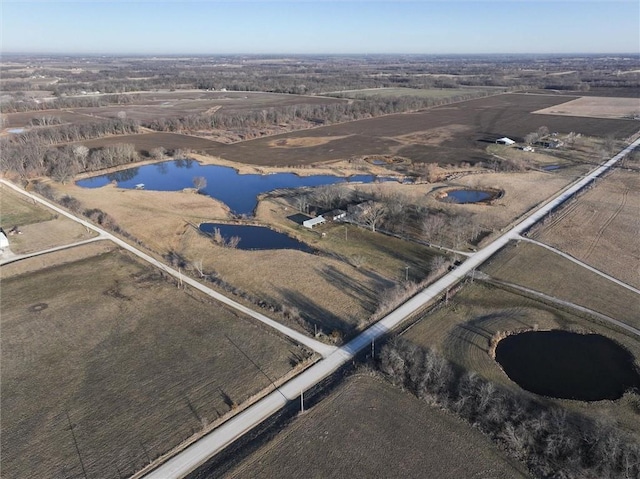 aerial view featuring a rural view and a water view