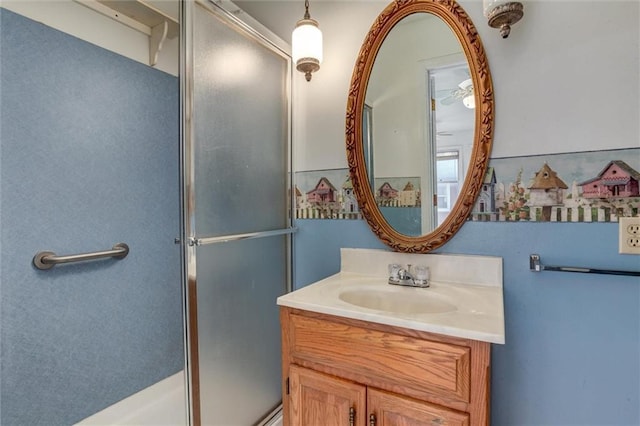 full bathroom with vanity and a stall shower