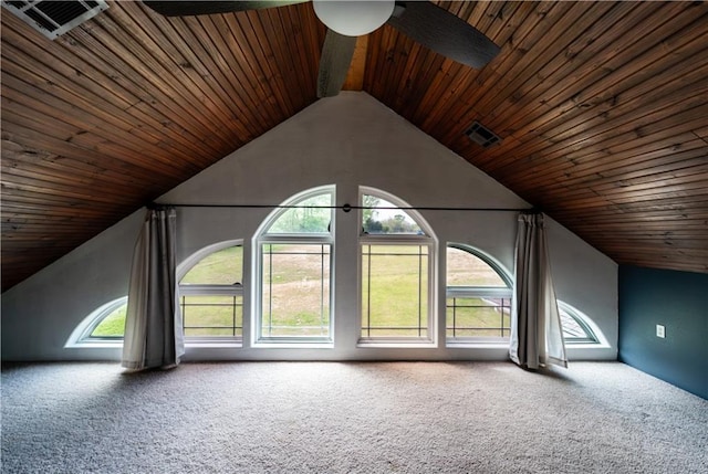 additional living space featuring vaulted ceiling, carpet floors, wooden ceiling, and ceiling fan