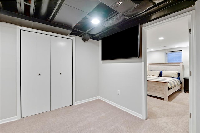 carpeted bedroom featuring recessed lighting, a closet, and baseboards