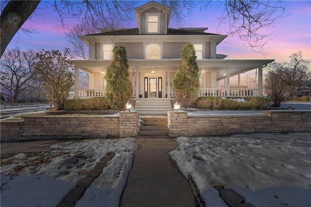 view of front facade with a porch and stucco siding