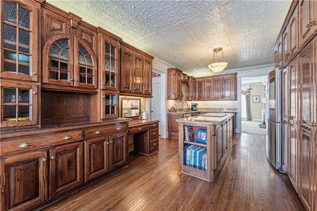 kitchen with dark wood-style floors, an ornate ceiling, glass insert cabinets, and ornamental molding