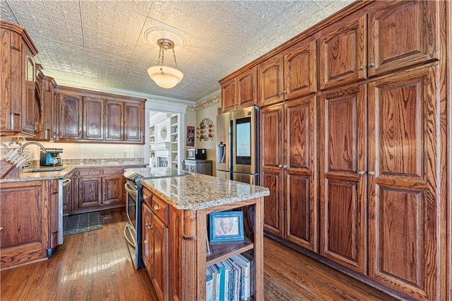 kitchen featuring ornamental molding, a sink, light stone counters, an ornate ceiling, and appliances with stainless steel finishes