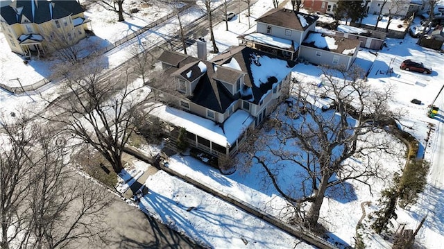 snowy aerial view featuring a residential view