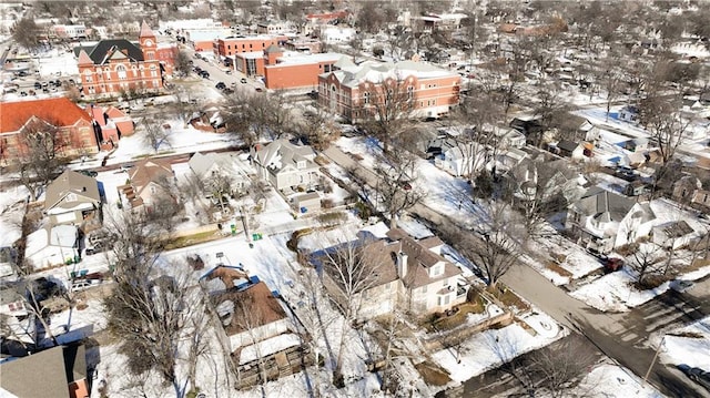 snowy aerial view with a residential view