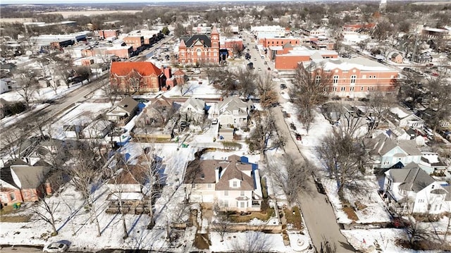 snowy aerial view featuring a residential view