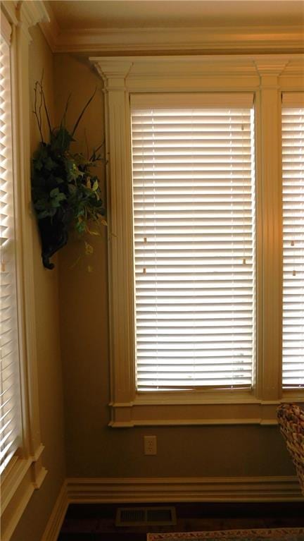 details with visible vents and crown molding