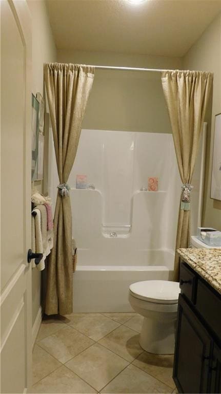 full bath with tile patterned floors, shower / tub combo, toilet, and vanity