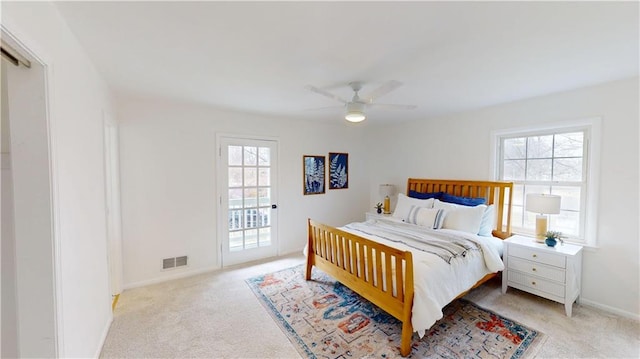 bedroom with light carpet, visible vents, baseboards, ceiling fan, and access to outside