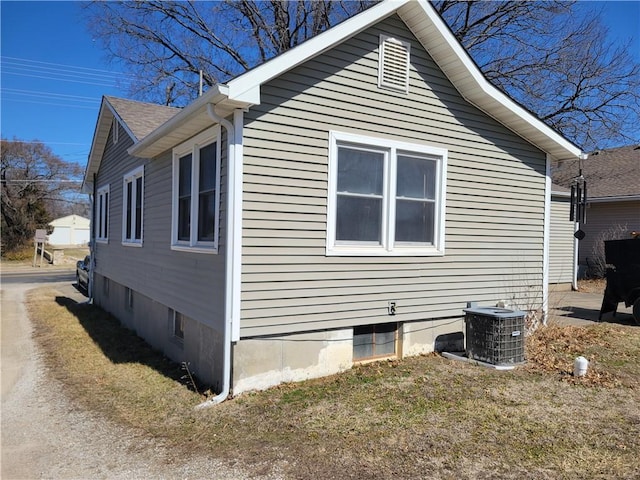 view of side of property with central AC unit