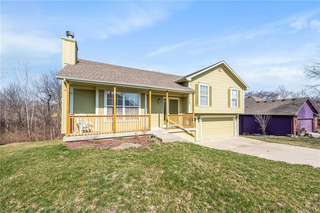 split level home with driveway, an attached garage, a porch, and a front yard