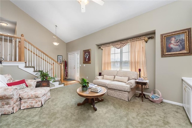 living room with stairway, baseboards, carpet floors, and high vaulted ceiling