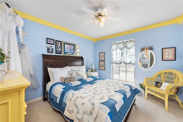 bedroom featuring light carpet, baseboards, crown molding, and ceiling fan