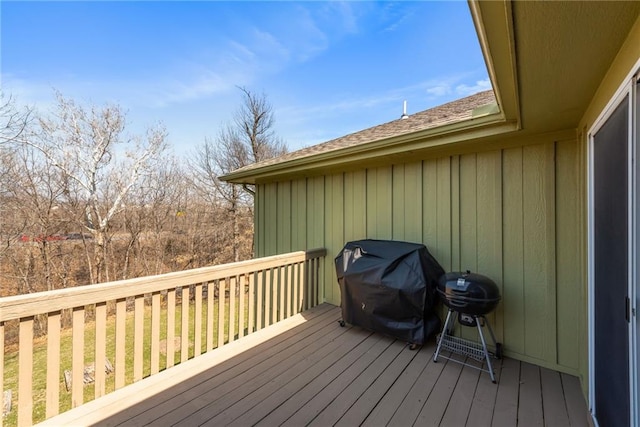 wooden terrace featuring a grill