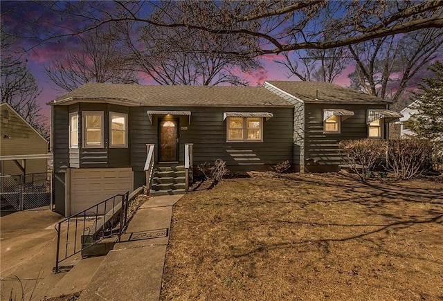 view of front of home with an attached garage and driveway