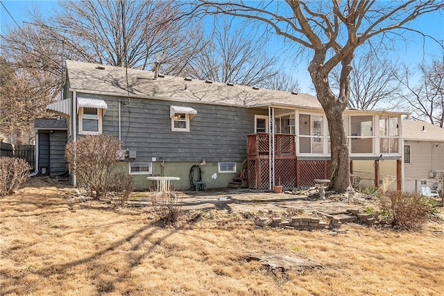 rear view of house with a sunroom