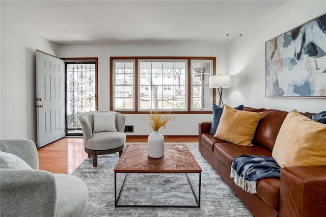 living room with wood finished floors and baseboards