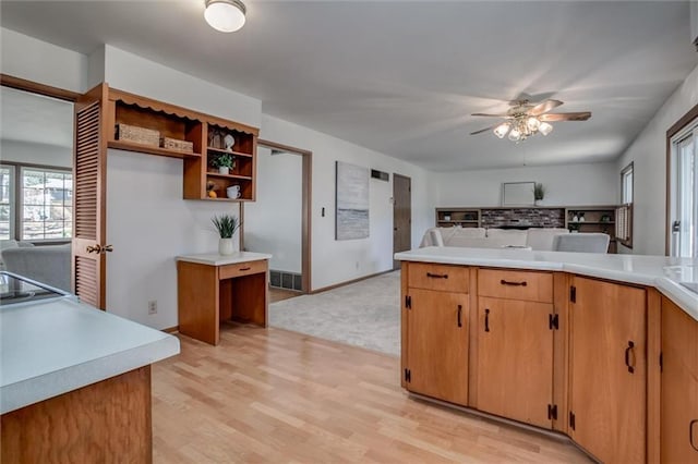 kitchen featuring open shelves, light countertops, visible vents, and ceiling fan