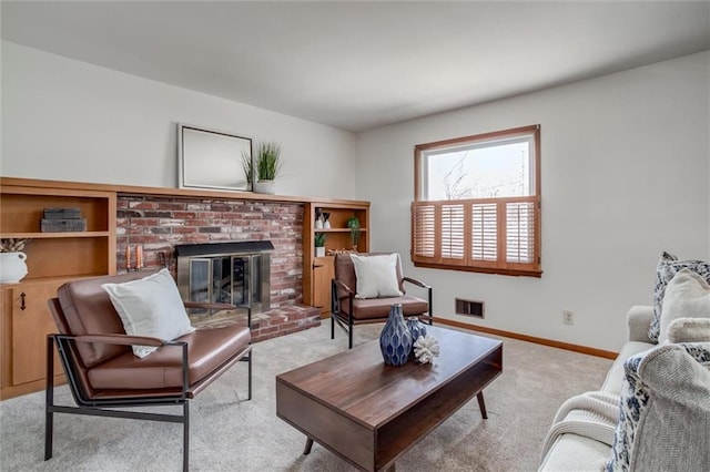 living room featuring visible vents, baseboards, carpet, and a fireplace