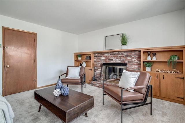 living room featuring baseboards, light colored carpet, and a fireplace